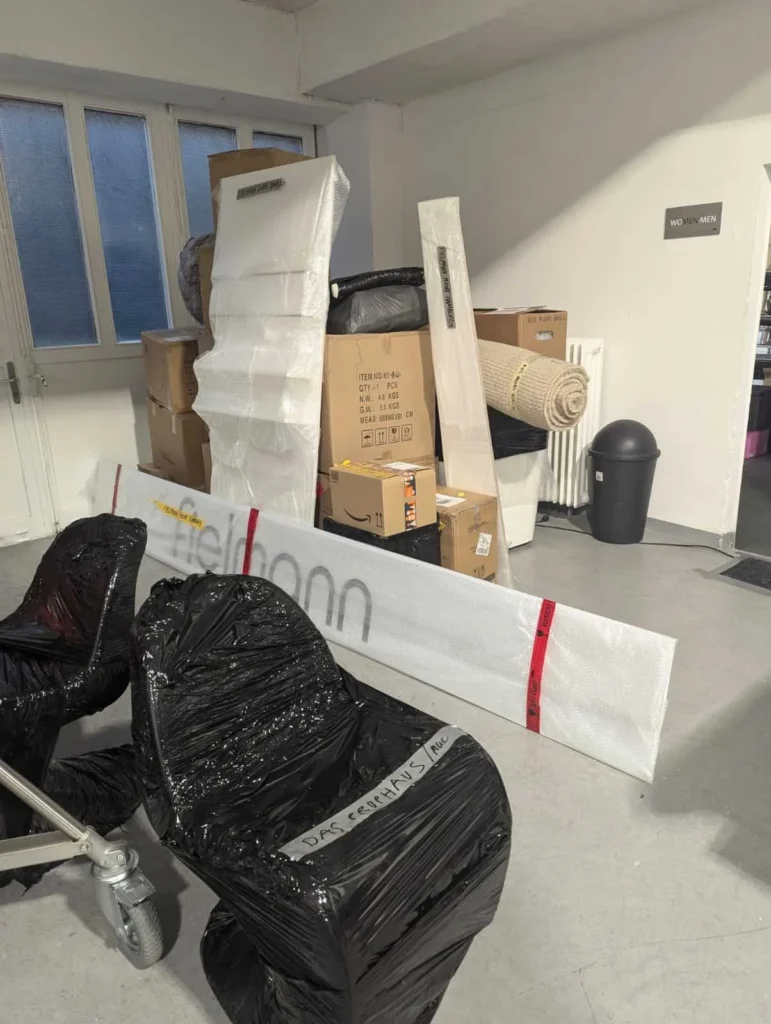 VANonsite student removals with packed boxes, bags and a wrapped mattress ready for collection