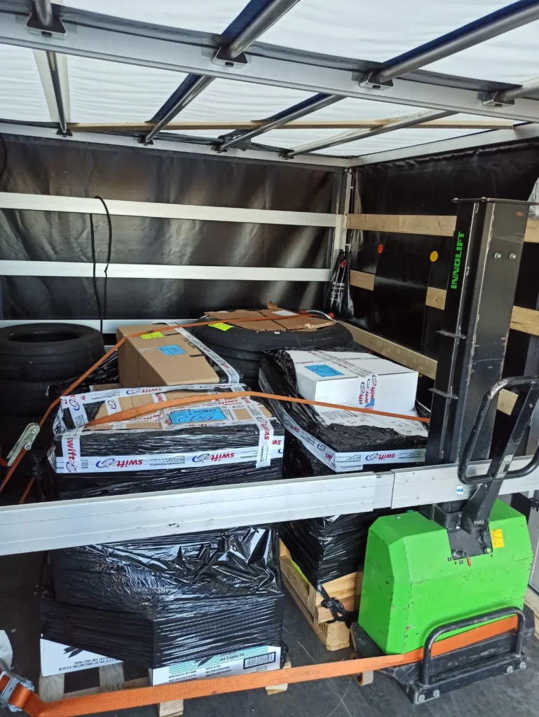VANonsite student removals with wrapped furniture, suitcases and boxes secured in the van
